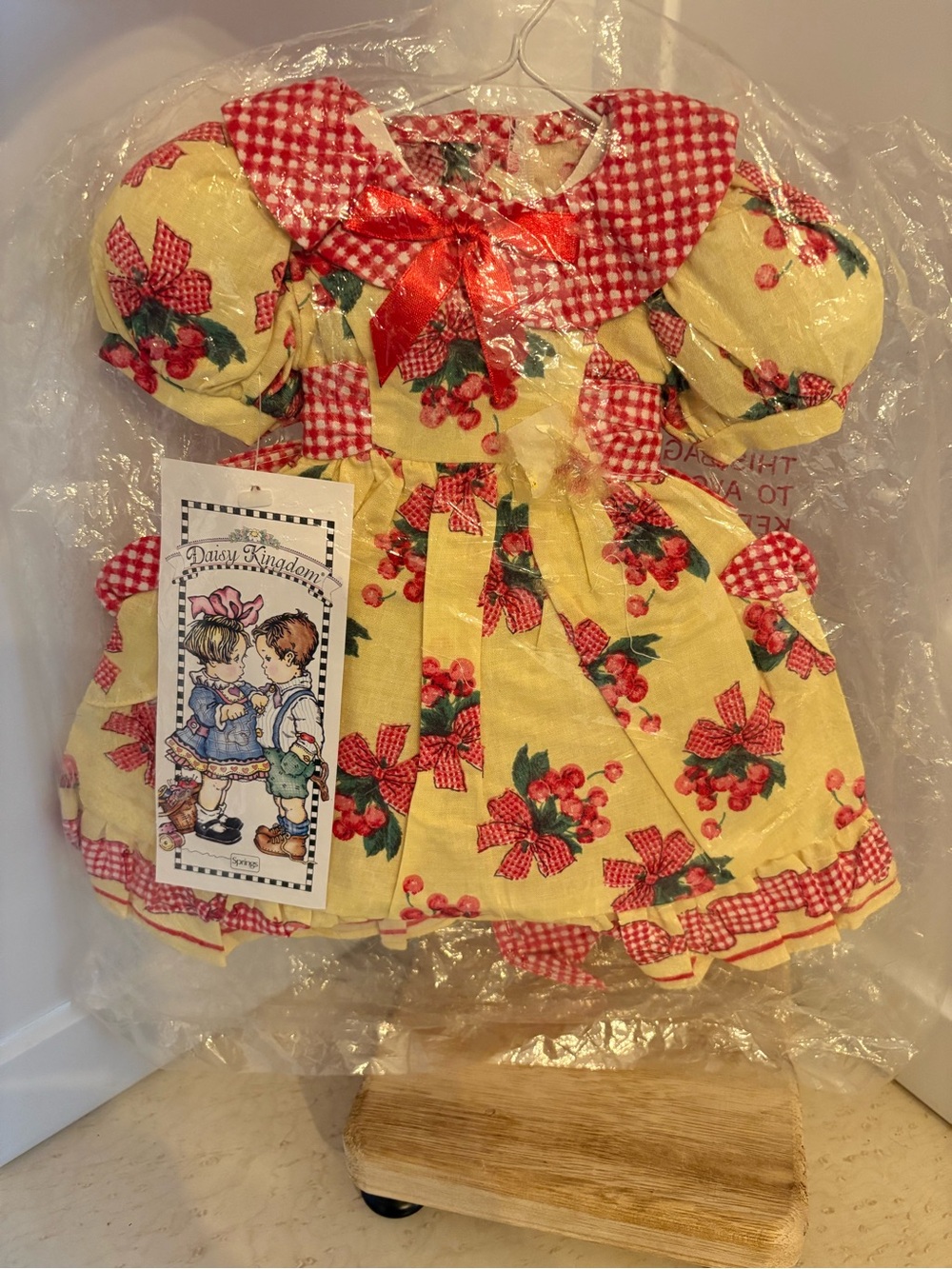 Vintage Yellow cherry print dress with a red gingham collar  by Daisy Kingdom.